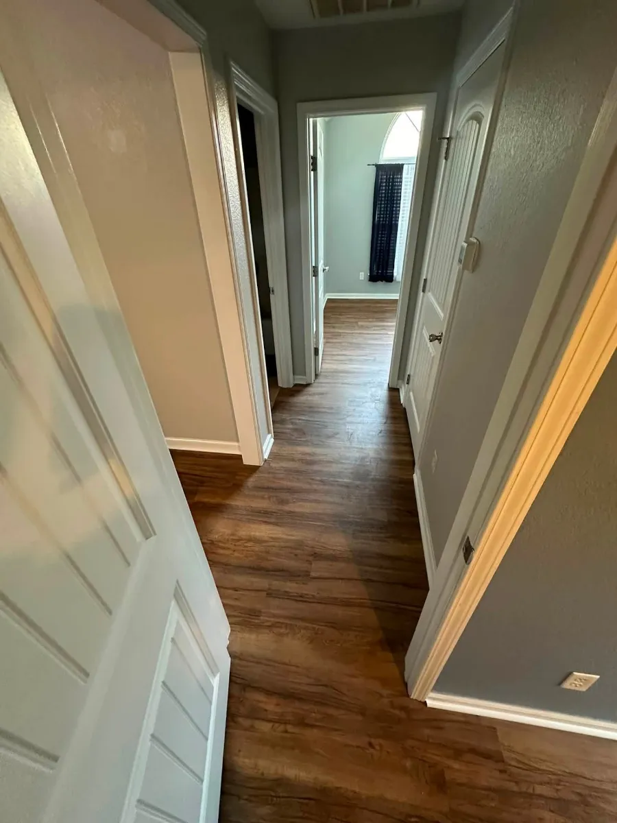 The same hallway with new flooring after the rebuild