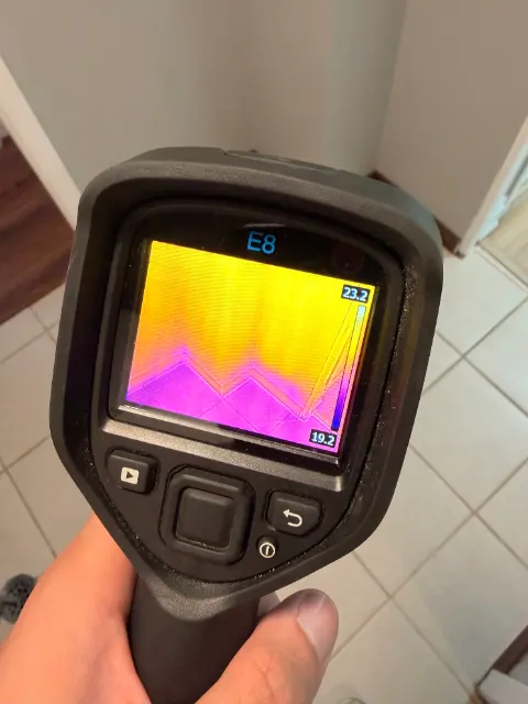 Thermal image showing a cold, wet band along the bottom of a wall